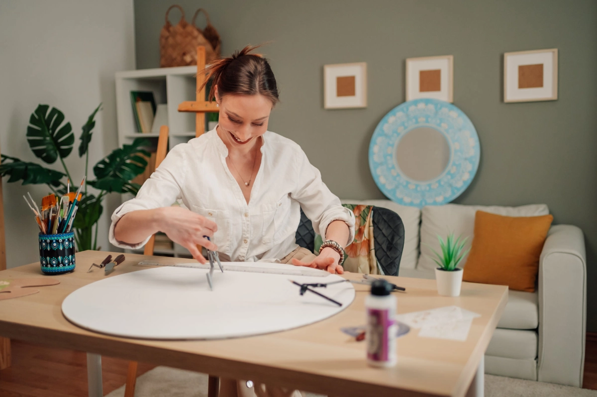 Woman painting in cozy studio