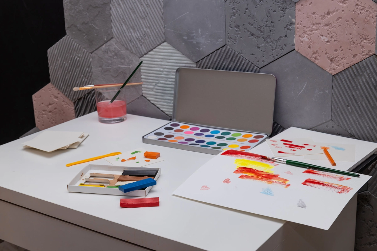 Art supplies on white desk