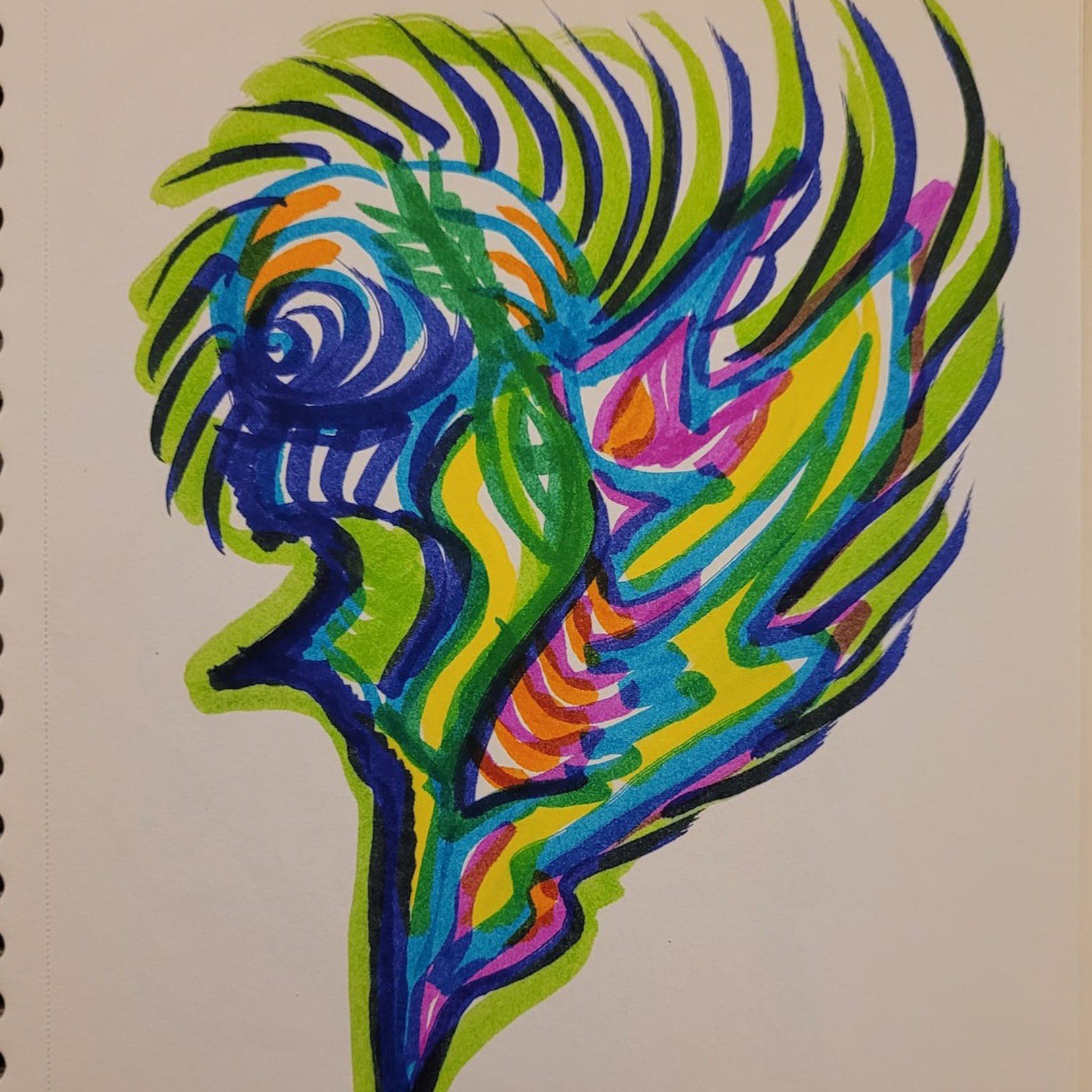 Colorful abstract face with flowing shapes on paper.